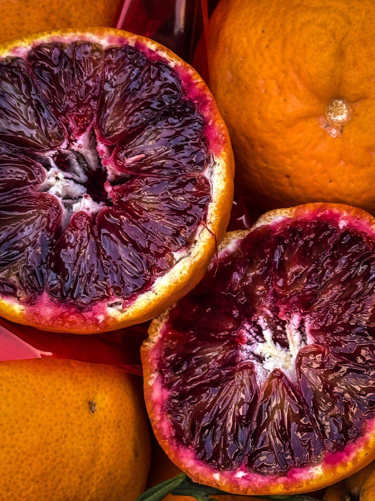 Blood oranges at a market stall in La Spezia, Italy, photographed by Cole Sjoholm